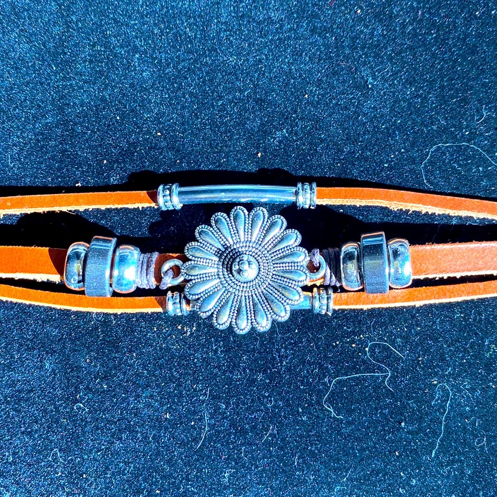 Leather silver tone flower bracelet